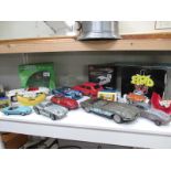 A quantity of boxed and unboxed die-cast and tin plate cars including Corgi,