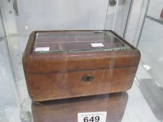 A vintage leather and glass jewellery box