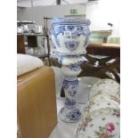 A blue and white jardiniere and stand