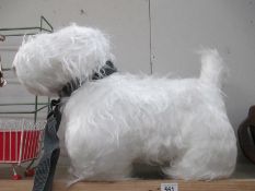 A large cuddly terrier dog toy