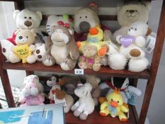 Two shelves of soft toys