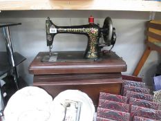 A Bradbury medium sewing machine in case