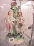 A Staffordshire figure of a Man and Woman