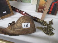 An ornamental axe and a wine/ale flask