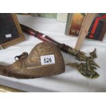 An ornamental axe and a wine/ale flask