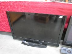 A LUXOR TV with remote