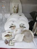 A collection of Fieldings Crown Devon fish plates etc