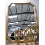 A framed wall mirror