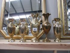 4 brass two handled vases and another brass vase