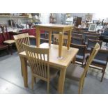 A Morris of Glasgow oak extending dining table, and 4 chairs,