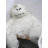 A large white monkey toy