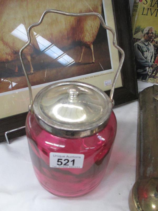 A cranberry biscuit barrel with silver plate handled lid