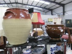 Two large earthenware pots one with lid