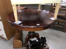 A mahogany tripod tea table