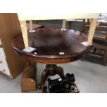 A mahogany tripod tea table