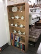 A pine effect bookshelf unit with adjustable shelves