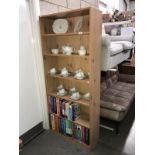 A pine effect bookshelf unit with adjustable shelves