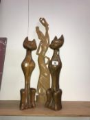 2 carved wooden cats & an oriental figurine