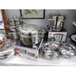 A quantity of vintage stainless steel saucepans/cookware,