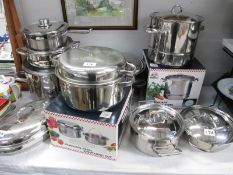 A quantity of vintage stainless steel saucepans/cookware,