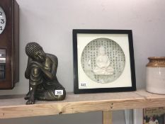 A Buddhist picture and statue.