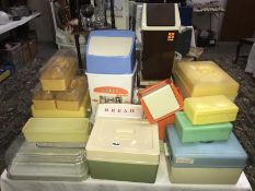 A quantity of vintage plastic Tupperware style storage boxes and bread bins.