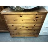 A solid pine chest of drawers