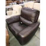 A brown leather recliner armchair