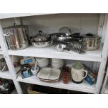 2 shelves of vinatge kitchenalia including stainless steel pans, mixing bowls etc.