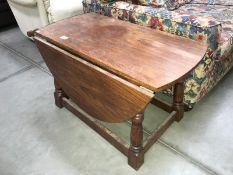 An oak gateleg table