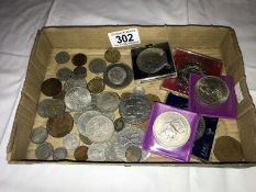 A tray of mixed UK coins including crowns.