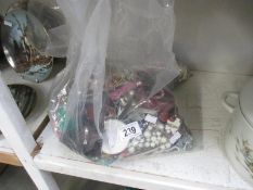 A large quantity of costume jewellery in 2 bags