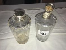 2 Victorian cut glass perfume bottles with tapered sides.