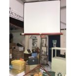 A vintage Airequip projector and screen.