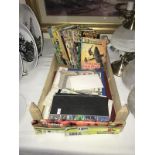 A wooden tray of comics, stamps and other ephemera.