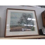A large framed and glazed print of the countryside