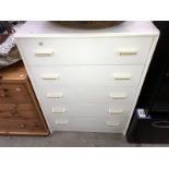 A white melamine chest of drawers