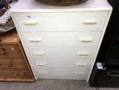 A white melamine chest of drawers