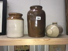A stoneware hot water bottle and 2 stoneware pots.