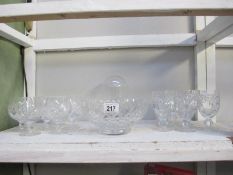 A collection of 2 sets of cut glass wine glasses,