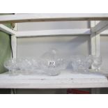 A collection of 2 sets of cut glass wine glasses,