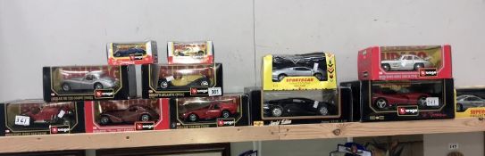 10 boxed Burago cars and 2 Shell sports car collection cars.