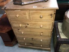 A solid pine chest of drawers