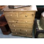 A solid pine chest of drawers