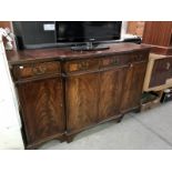 A dark wood stained Victorian style sideboard