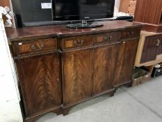 A dark wood stained Victorian style sideboard