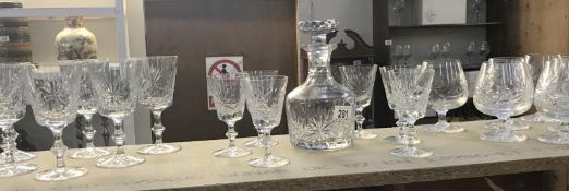 A cut glass decanter and 3 sets of glasses including Edinburgh crystal.