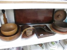 A shelf of wooden bowls and trays etc.