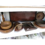 A shelf of wooden bowls and trays etc.