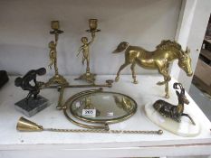 A mixed lot of brass and other items including discus thrower, springbok, mirror,